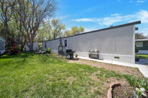 Exterior space with a lawn and entry steps