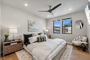 Bedroom with recessed lighting, light wood-style flooring, a ceiling fan, and baseboards