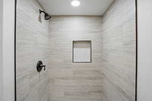 Full bathroom with a tile shower