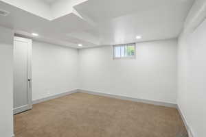 Below grade area with carpet floors, recessed lighting, and baseboards