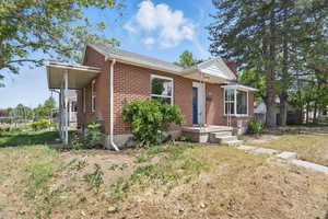 View of front of property with brick siding