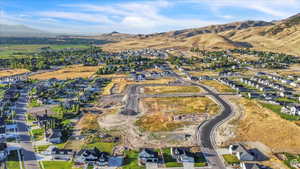 Birds eye view of property featuring a residential view and a mountain view