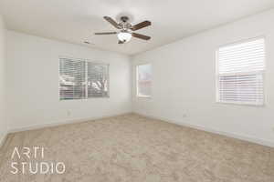 Unfurnished room featuring ceiling fan, baseboards, and carpet floors