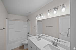 Bathroom featuring a sink, visible vents, and toilet