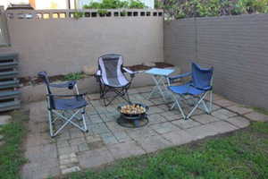 View of patio with a fenced backyard