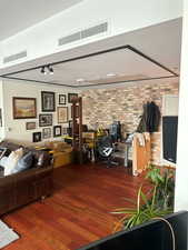Office area with brick accent wall