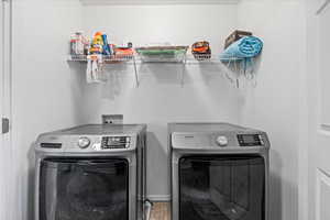 Laundry room featuring washing machine and dryer