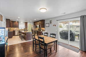 Dining space featuring visible vents, light wood-type flooring, and recessed lighting