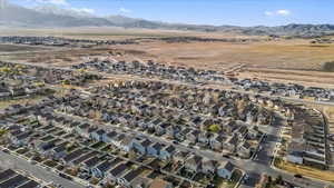 Birds eye view of property featuring a mountain view and a residential view