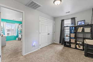 Interior space featuring visible vents, baseboards, and a closet