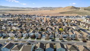 Birds eye view of property featuring a mountain view and a residential view