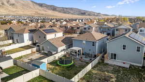 Birds eye view of property with a residential view and a mountain view