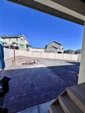 View of patio / terrace featuring a fenced backyard and a residential view