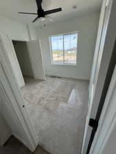 Unfurnished bedroom with baseboards, a ceiling fan, and carpet floors