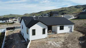 Rear view of property featuring a mountain view