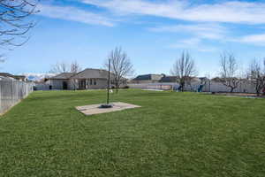 View of yard with a patio area and a fenced backyard