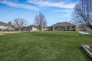 View of yard featuring fence
