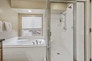 Bathroom with shower with separate bathtub