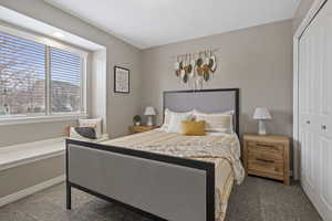 Bedroom with a closet and carpet flooring