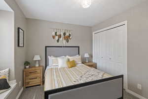 Bedroom featuring a closet and carpet flooring