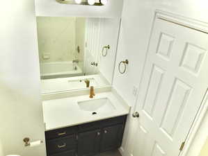 Full bath featuring a tub and vanity