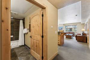 Corridor featuring baseboards