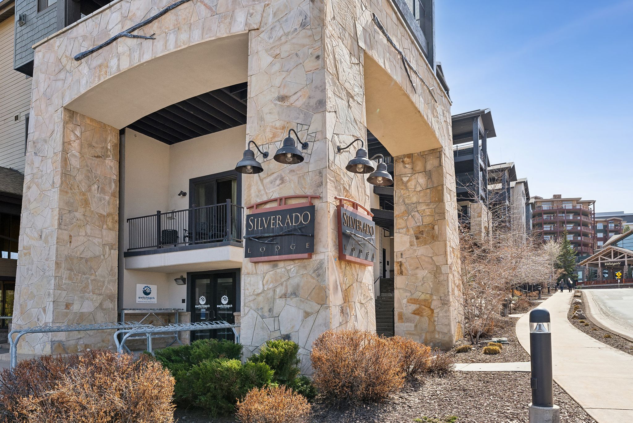 Stone veneer facade with an arched entryway