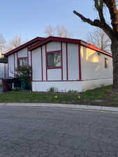 View of home's exterior with a yard