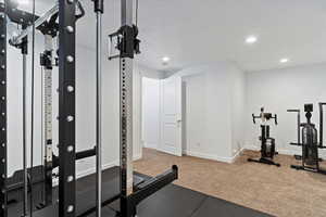 Workout room with recessed lighting, carpet flooring, and baseboards