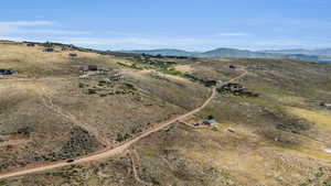 Drone / aerial view featuring a mountain view and a rural view