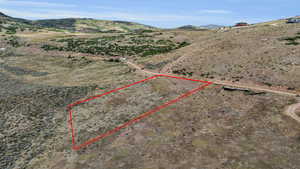 Birds eye view of property with a mountain view