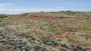 Birds eye view of property featuring a rural view