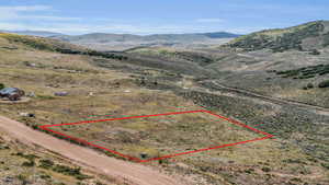 Birds eye view of property with a mountain view and a rural view