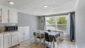 Dining space with a textured ceiling