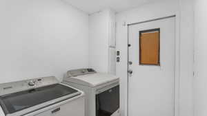 Laundry area with washer and clothes dryer and laundry area