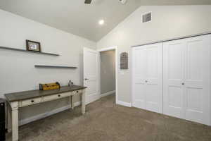 Bedroom featuring high vaulted ceiling, a closet, visible vents, carpet flooring, and baseboards