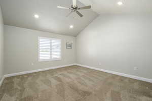 Empty room with recessed lighting, carpet flooring, vaulted ceiling, and ceiling fan