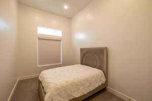 Bedroom featuring recessed lighting, baseboards, and carpet floors