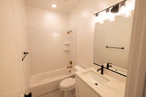 Full bath with vanity, shower / tub combination, recessed lighting, toilet, and tile patterned floors