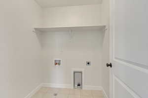 PHOTOS FROM SIMILAR HOME. OPTIONS AND FINISHES WILL VARY. Laundry room with laundry area, light tile patterned floors, hookup for a washing machine, electric dryer hookup, and baseboards