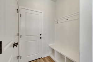 PHOTOS FROM SIMILAR HOME. OPTIONS AND FINISHES WILL VARY. Mudroom with light wood-style floors