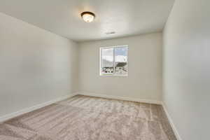 PHOTOS FROM SIMILAR HOME. OPTIONS AND FINISHES WILL VARY. Bedroom 3 featuring light carpet, visible vents, and baseboards