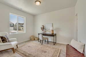 PHOTOS FROM SIMILAR HOME. OPTIONS AND FINISHES WILL VARY. Living area with baseboards, visible vents, and carpet floors