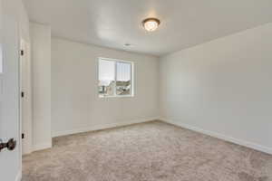PHOTOS FROM SIMILAR HOME. OPTIONS AND FINISHES WILL VARY. Bedroom 2 featuring carpet, visible vents, and baseboards