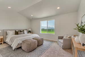 PHOTOS FROM SIMILAR HOME. OPTIONS AND FINISHES WILL VARY. Primary suite bedroom featuring recessed lighting, baseboards, and lofted ceiling