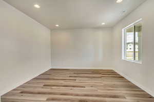 PHOTOS FROM SIMILAR HOME. OPTIONS AND FINISHES WILL VARY. Formal living room with visible vents, baseboards, recessed lighting, and light wood finished floors