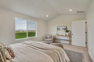 PHOTOS FROM SIMILAR HOME. OPTIONS AND FINISHES WILL VARY. Carpeted primary suite bedroom with visible vents, recessed lighting, and lofted ceiling