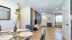 Dining area featuring recessed lighting and light wood-style floors