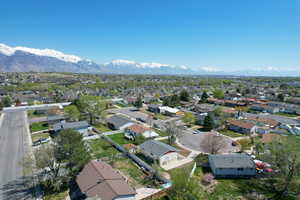 Birds eye view of property with a mountain view and a residential view