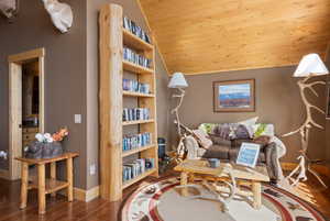 Living area with wooden ceiling, wood floors and vaulted ceiling